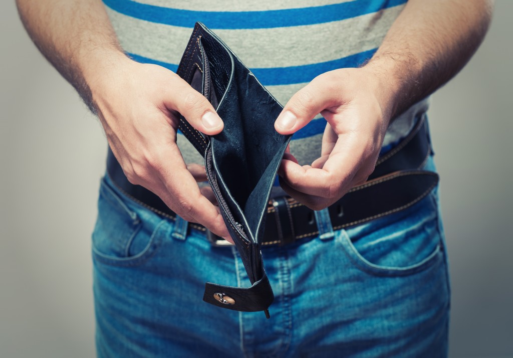 Man showing his empty wallet
