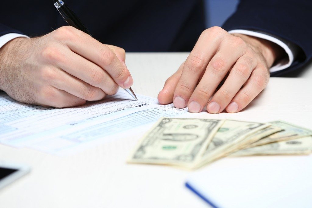 Man computing his money
