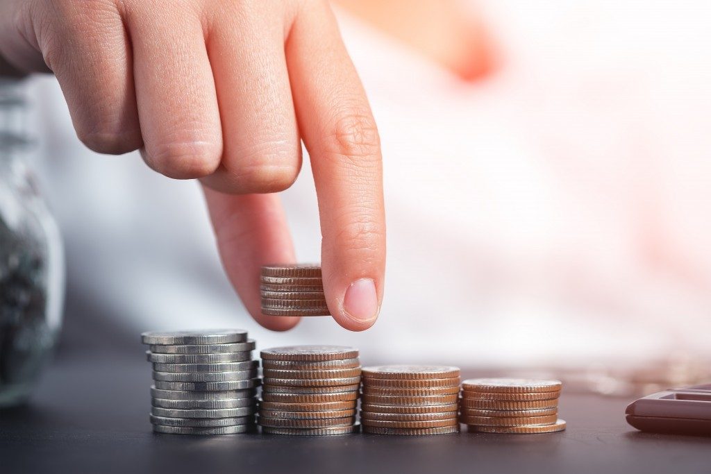 Man stacking coins