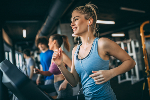 woman listening to music while working out