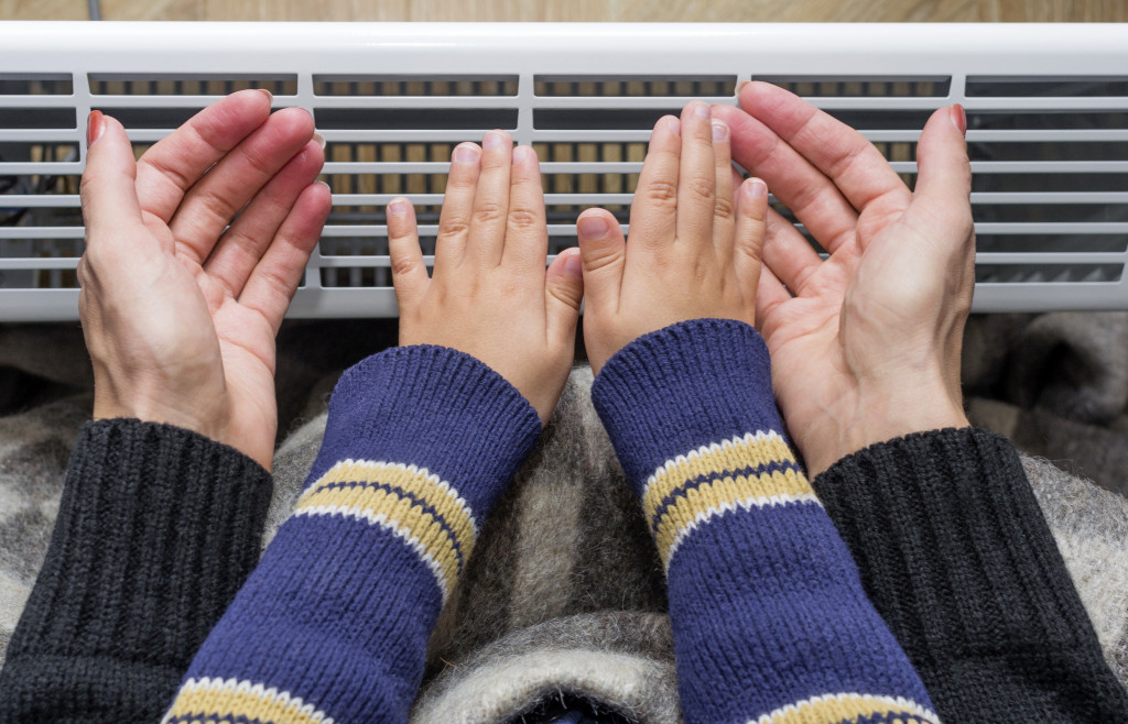 Hands on an airconditioner