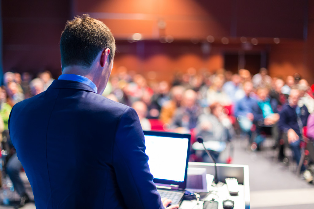 man talking in a convention