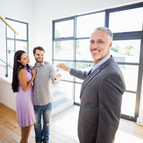 couple and real estate agent