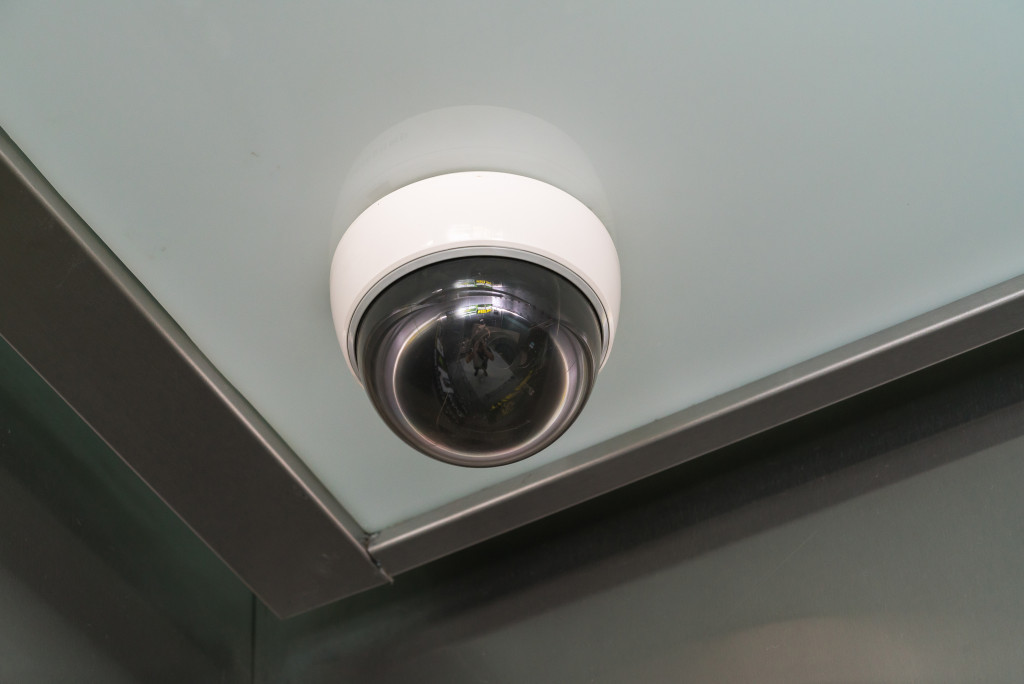 A security camera on the corner of the ceiling