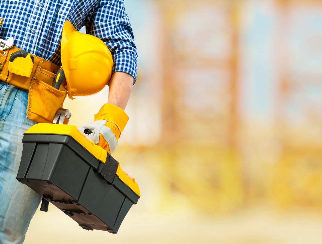 A construction worker wearing proper equipment