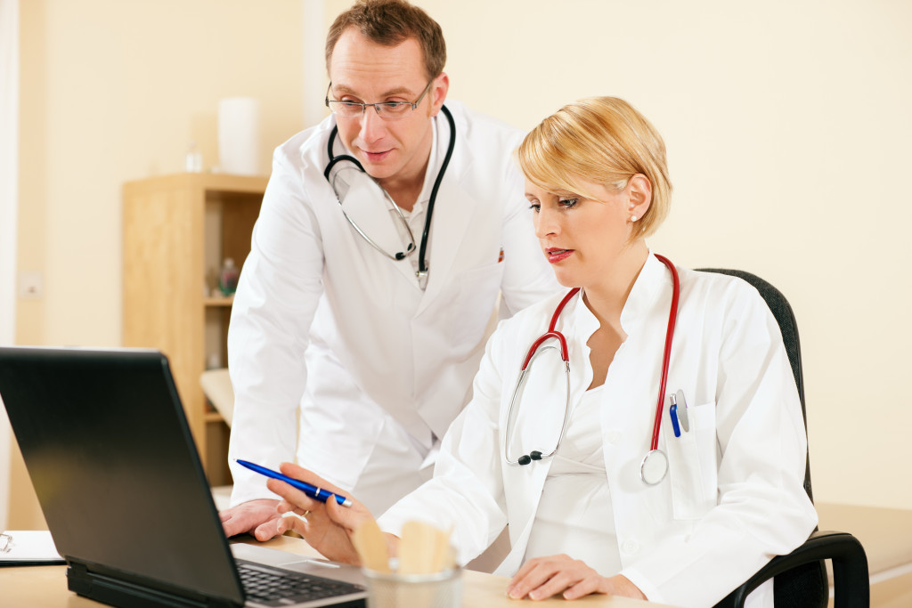 doctors using a laptop