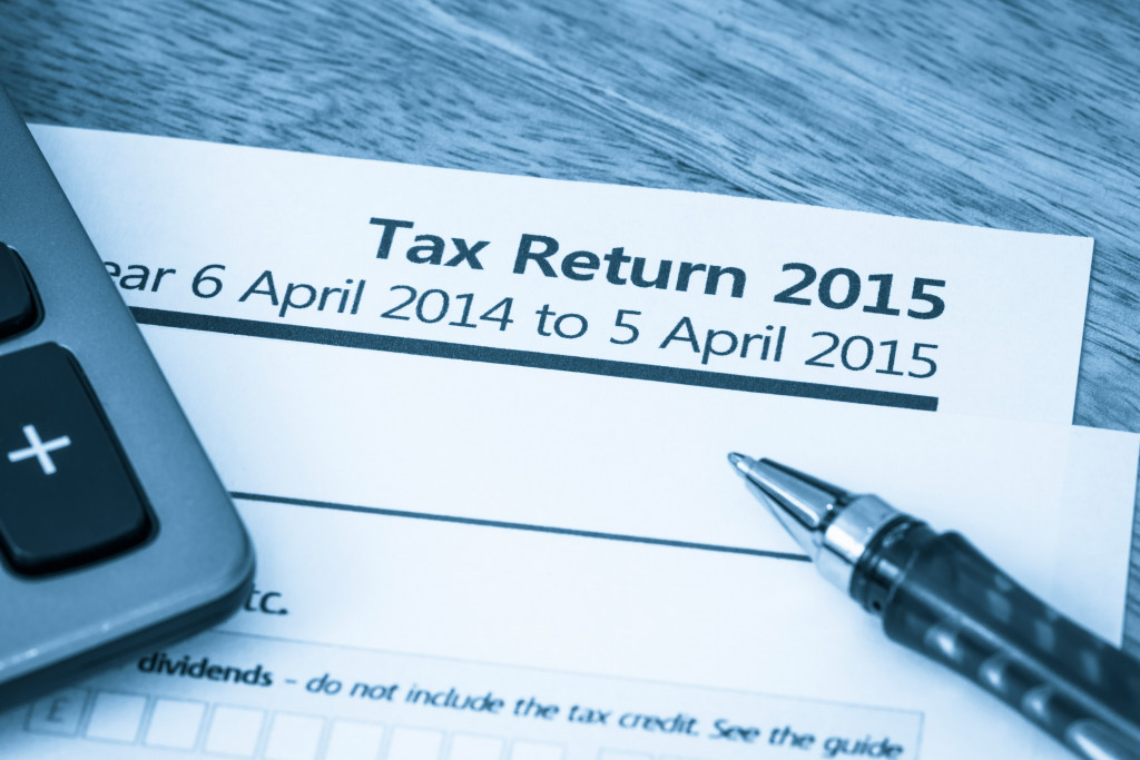 Tax return document 2015 with a pen and calculator