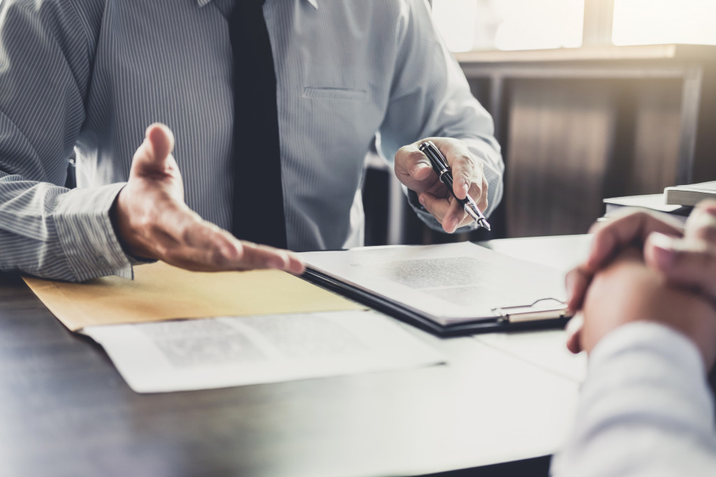 A lawyer discussing regulations with landlord