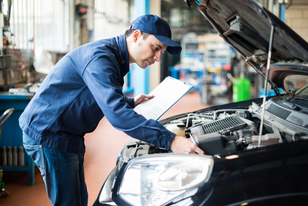 mechanic inspecting a car