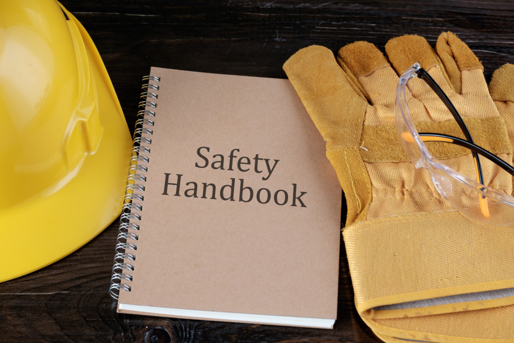 A safety handbook in between safety gear