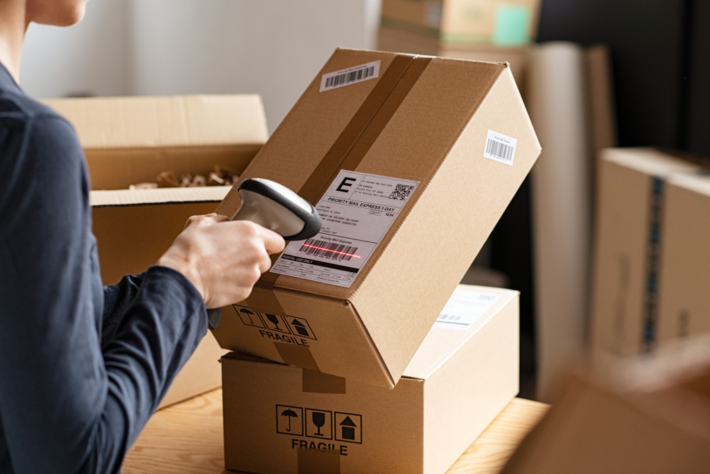 a man scanning a label for shipping