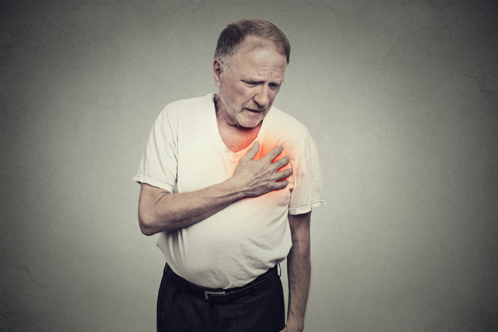 Old man with heartburn