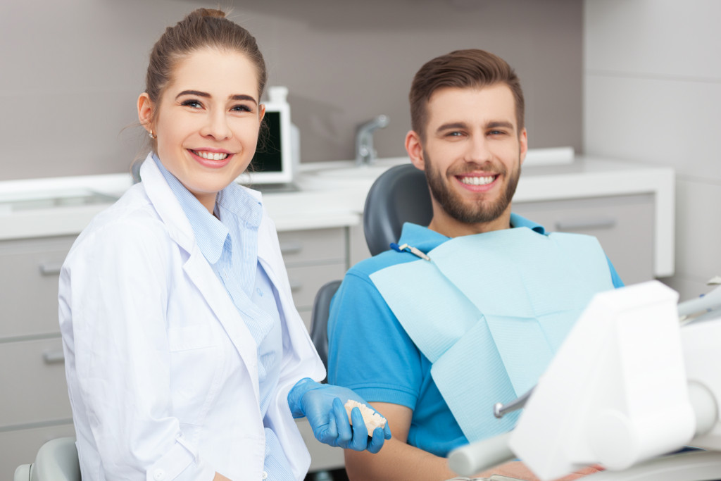 dentist with a smiling patient