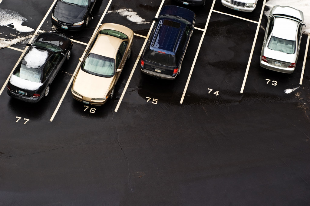 commercial parking space filled with cars