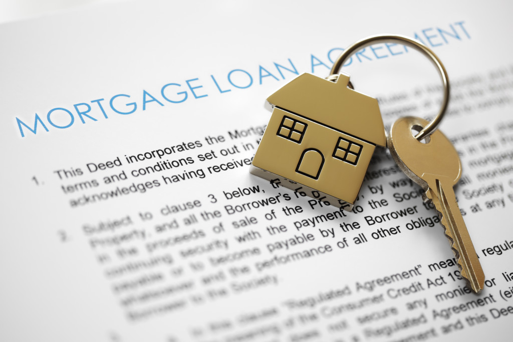 Mortgage loan agreement document with keys