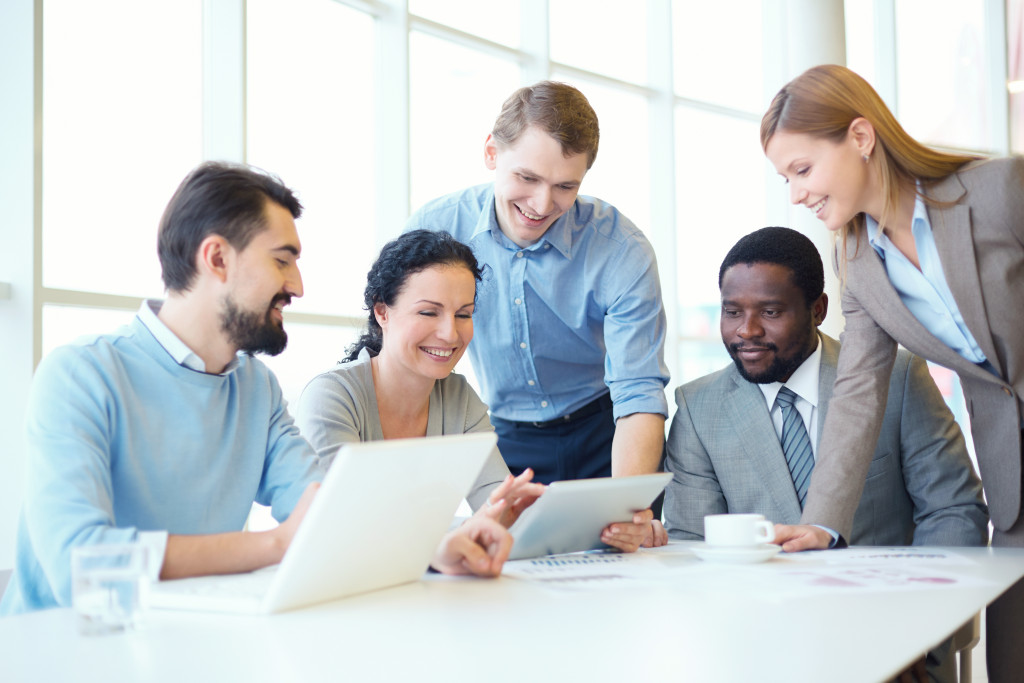 people smiling and discussing