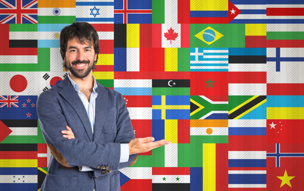 Businessman over various flags of different countries