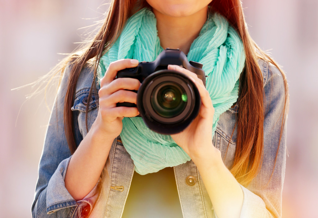 woman holding her camera