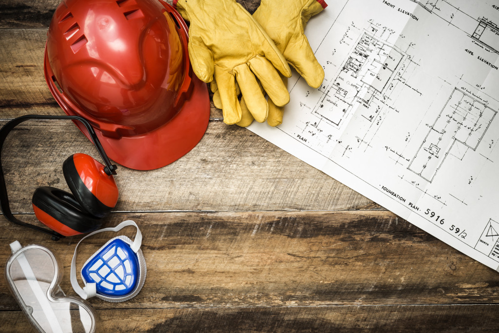 hard hat, gloves, mask, and headphones