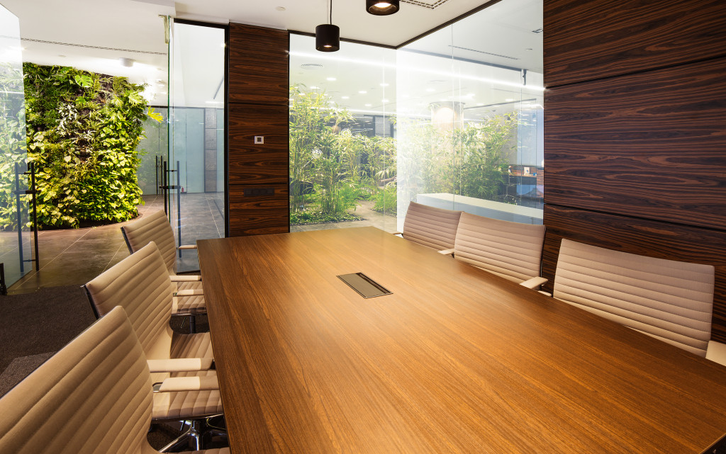 conference room with natural materials and living walls at the back