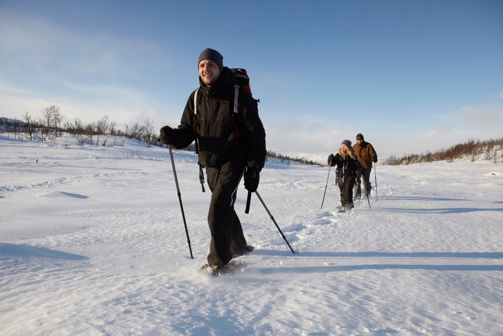 cross-country skiers walking in snow