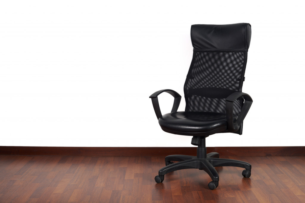 A black office chair on a white background