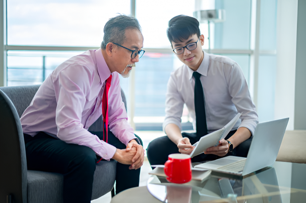 insurance agent talking to his middle-aged client